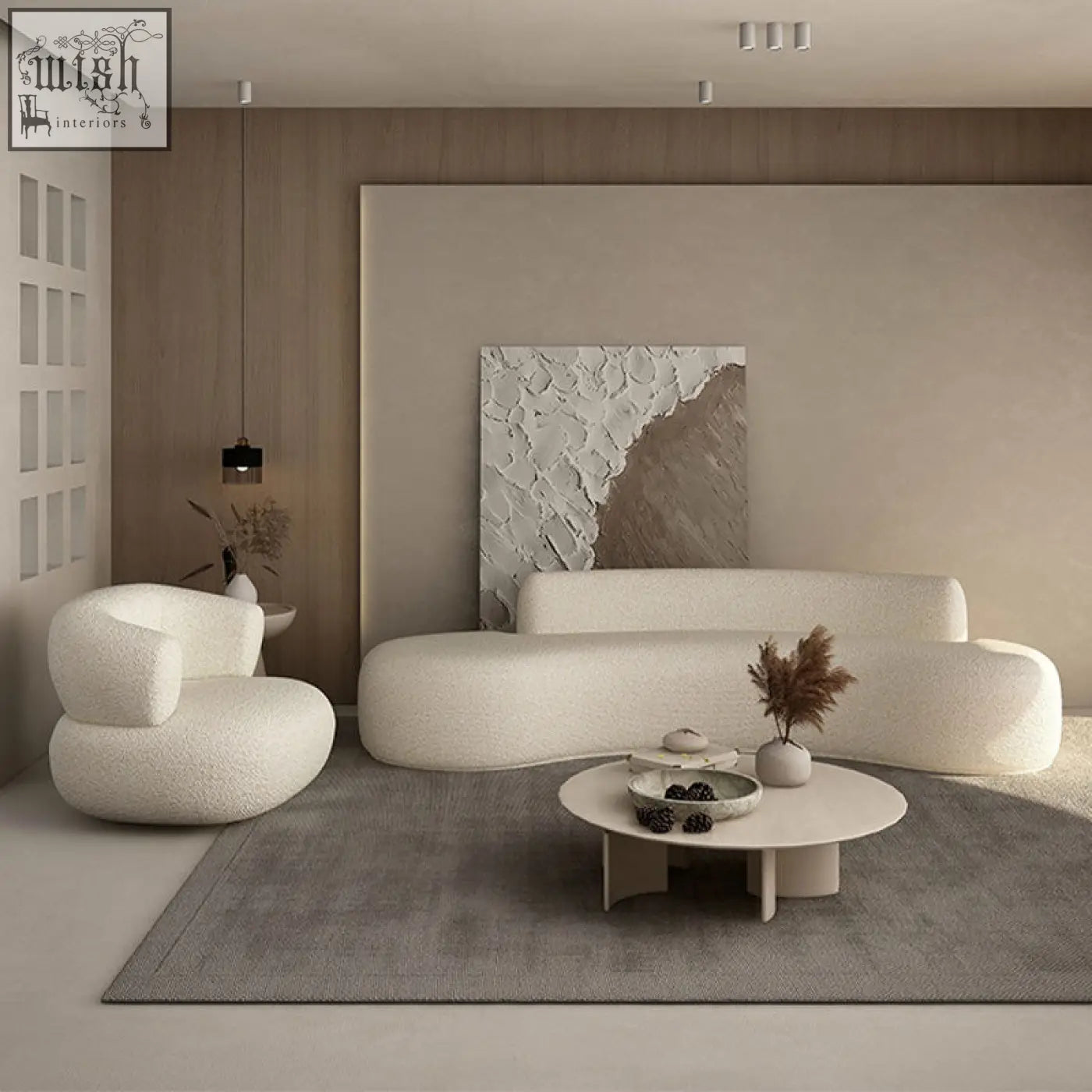Cream-colored deirdre armchair in white boucle with plush texture and rounded minimalist design