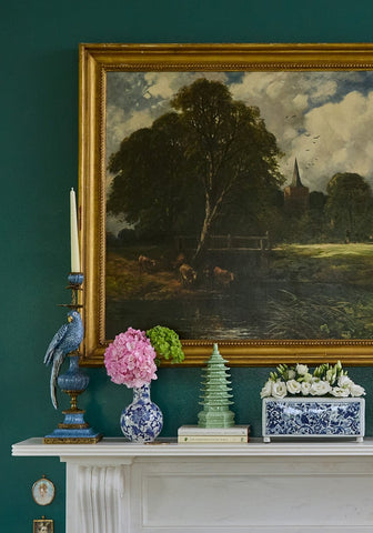 Delft tulipiere rectangle vase made of blue and white ceramic holding a bouquet of pink hydrangeas