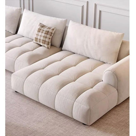 Beige tufted delilah violet two seater sofa with plush cushions and plaid accent pillow for comfortable seating