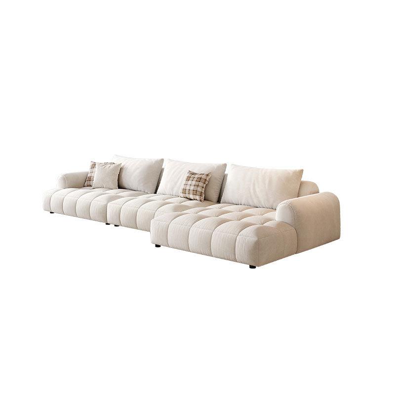 Beige tufted delilah violet two seater sofa with plush cushions and plaid accent pillows in cream four seater sofa style