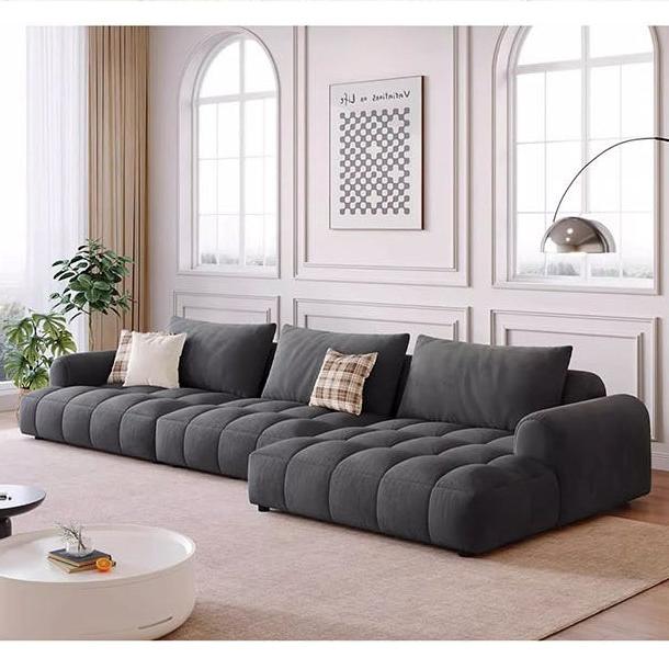 Delilah violet two dark gray tufted sectional sofa with plush segmented cushions and modern design four seater sofa