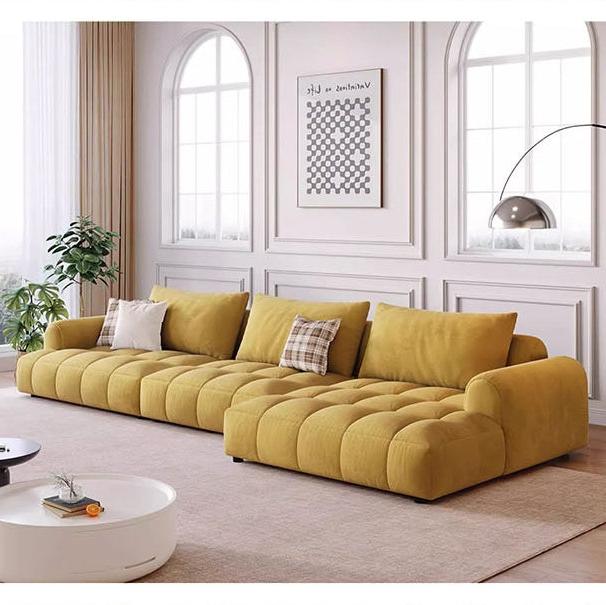 Mustard yellow tufted delilah violet two seater four seater sofa with plush cushions and modern modular design