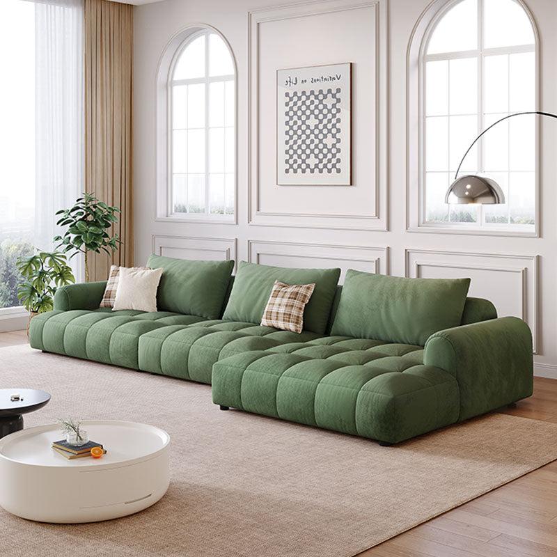 Delilah violet two seater velvet sofa in sage green with tufted quilted design and soft upholstery four seater sofa option