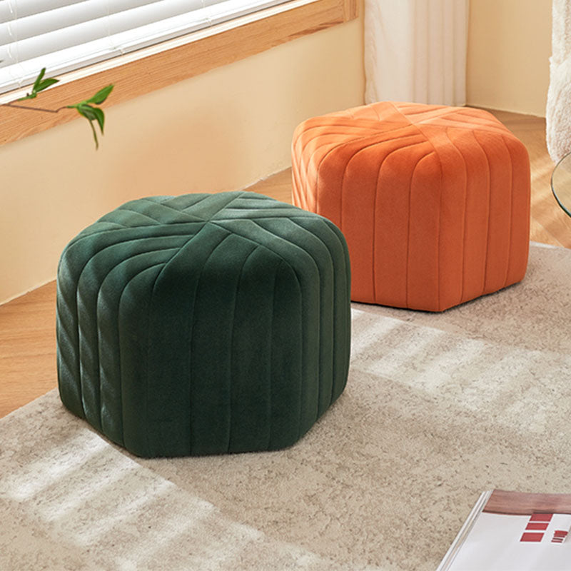 Deep green velvet della footstool featuring a quilted geometric pattern for stylish comfortable seating