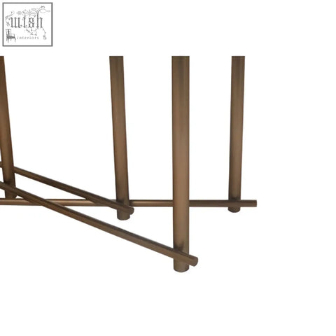 Bronze finished metal table legs with a sleek minimalist design on a delta walnut veneer dining table with brushed brass legs