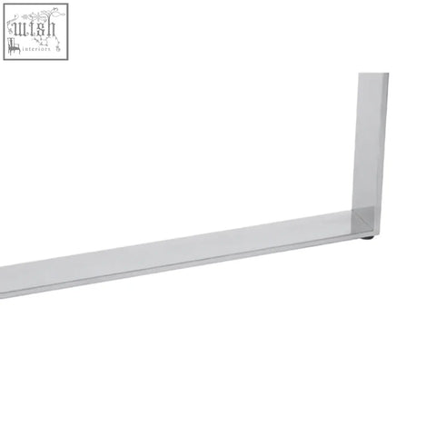 Clear glass shower door frame with sleek modern design beside the demas console table in a stylish setting