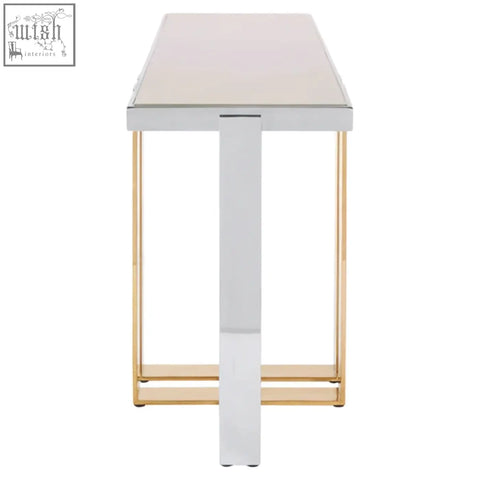 Modern demas console table with a sleek white top and gold toned metal legs perfect for stylish entryways