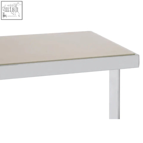 White rectangular demas console table with smooth light beige glass top and sleek metallic legs