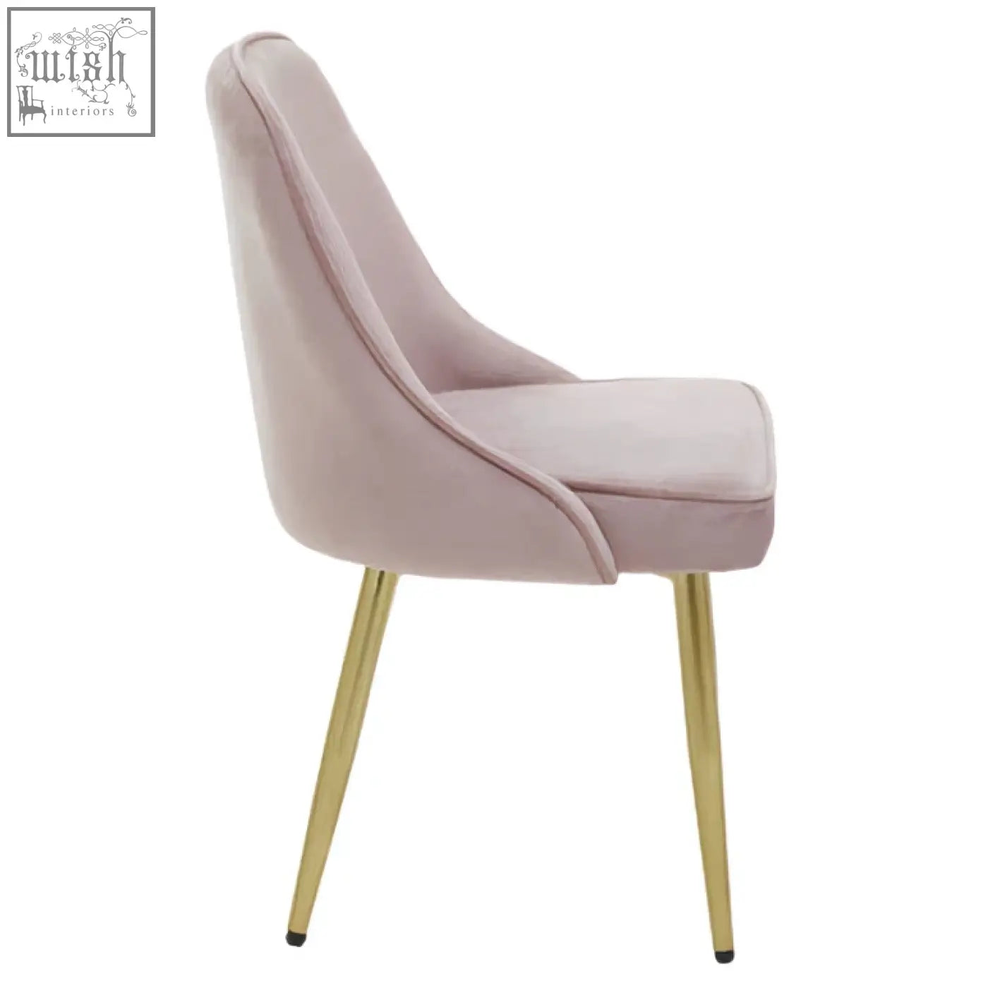 A demi dusky pink velvet dining chair with a blush pink velvet seat and slender gold metal legs
