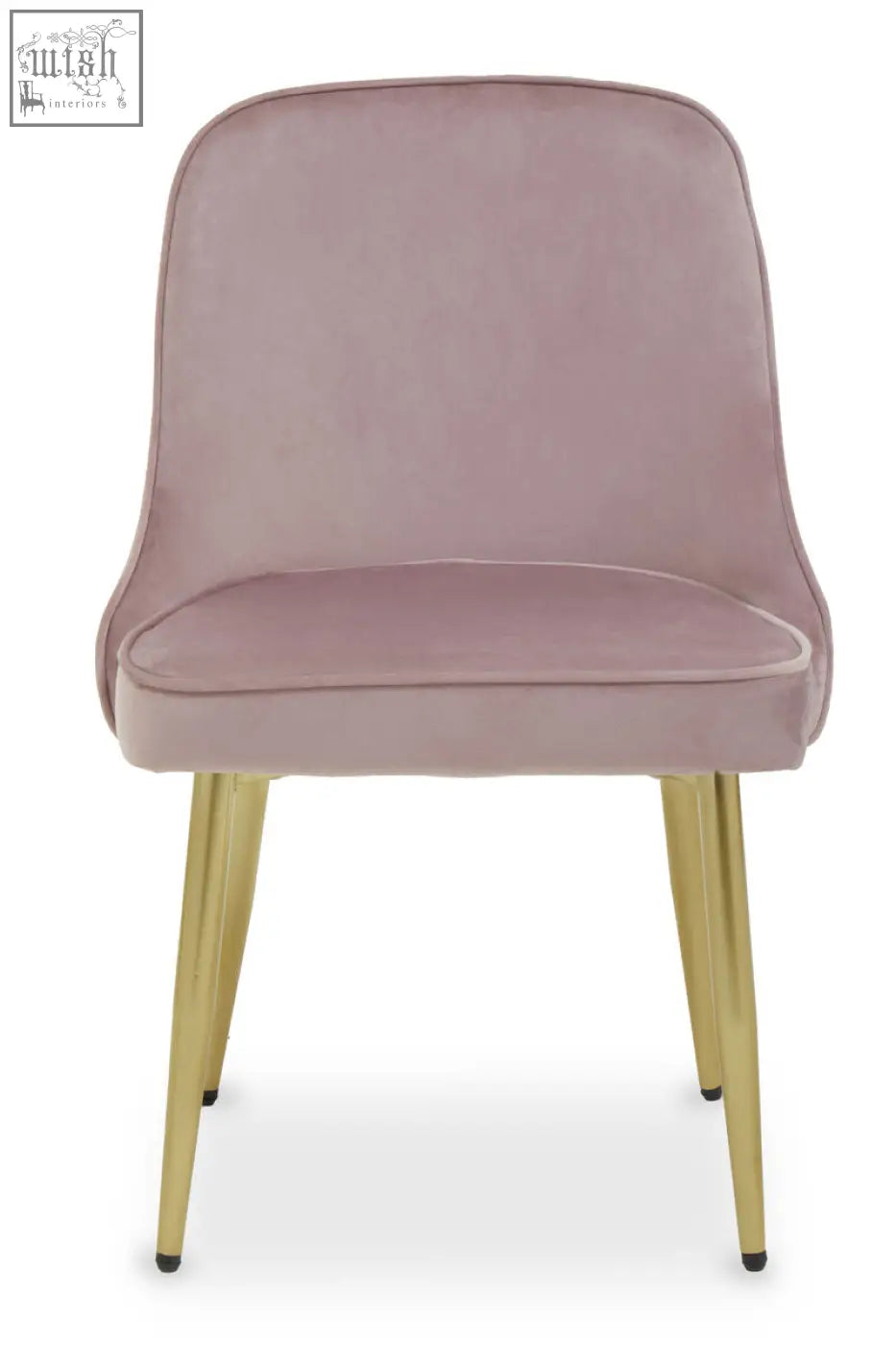 A demi dusky pink velvet dining chair with soft blush pink velvet upholstery and sleek gold metal legs