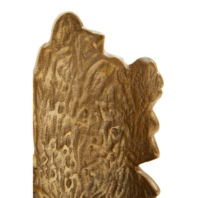 Golden intricately engraved metal plaque with textured organic patterns on deomali small ombre black and gold candle holder
