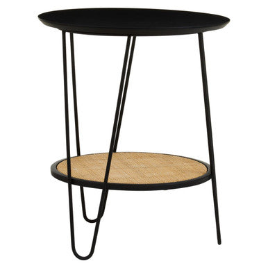 Black metal side table with hairpin legs featuring a round depok rattan top and woven cane lower shelf