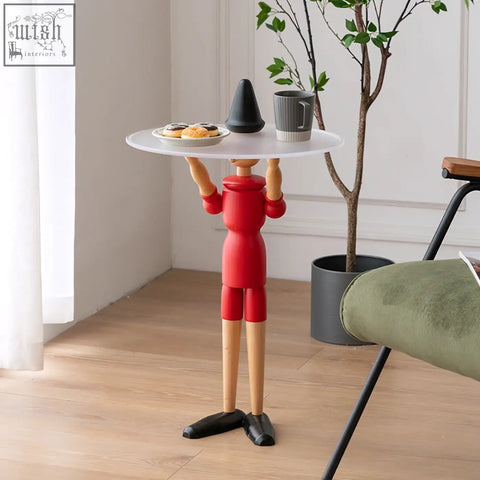 Red solid wood derby pinocchio puppet side table with white circular tray held up by its arms
