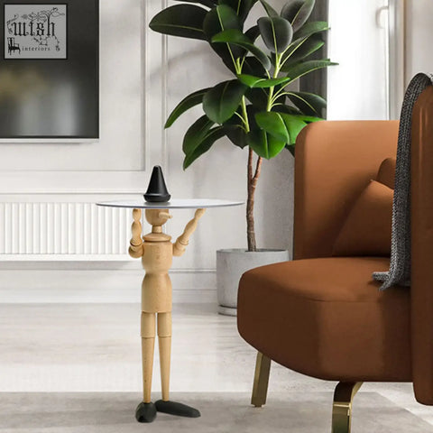 Derby pinocchio puppet side table with articulated solid wood limbs and round glass top featuring a black cone