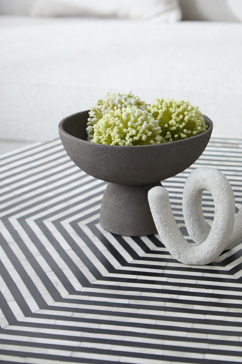Gray ceramic pedestal bowl with textured grey matte finish and small pedestal base perfect for serving or decor
