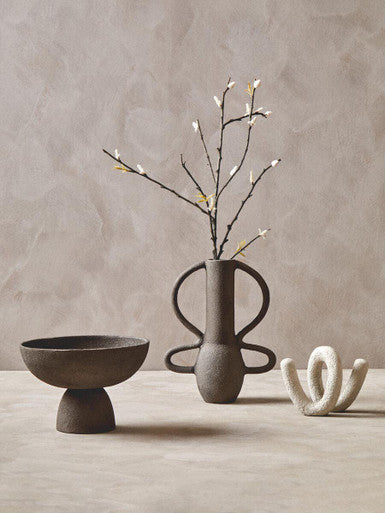 Earthenware textured grey pedestal bowl with abstract sculptural form and matte gray finish