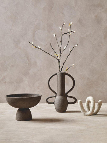 Earthenware textured grey pedestal bowl with abstract sculptural form and matte gray finish
