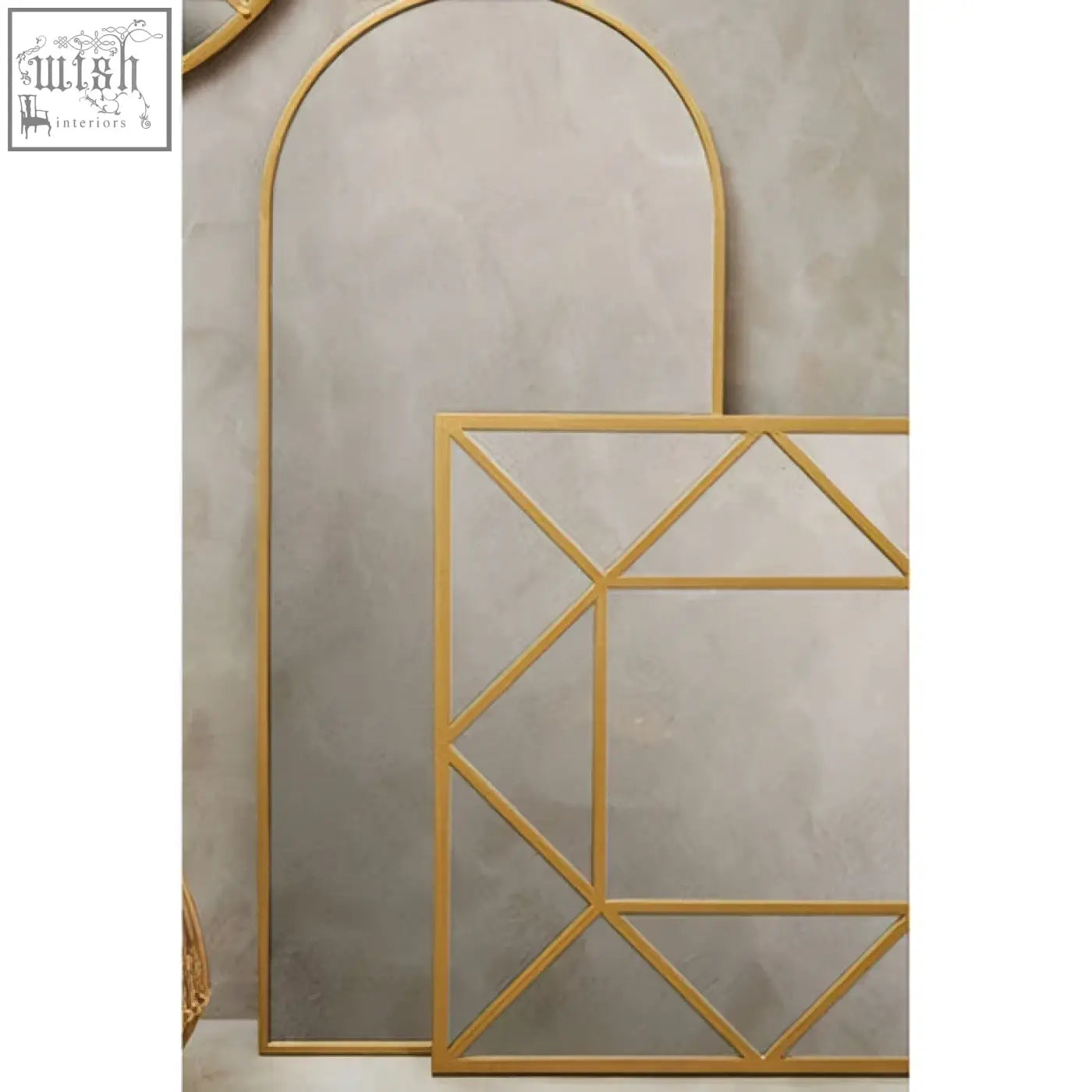 Descartes gold frame wall mirror with gold-toned geometric design featuring an arched top and rectangular frame wall mirror