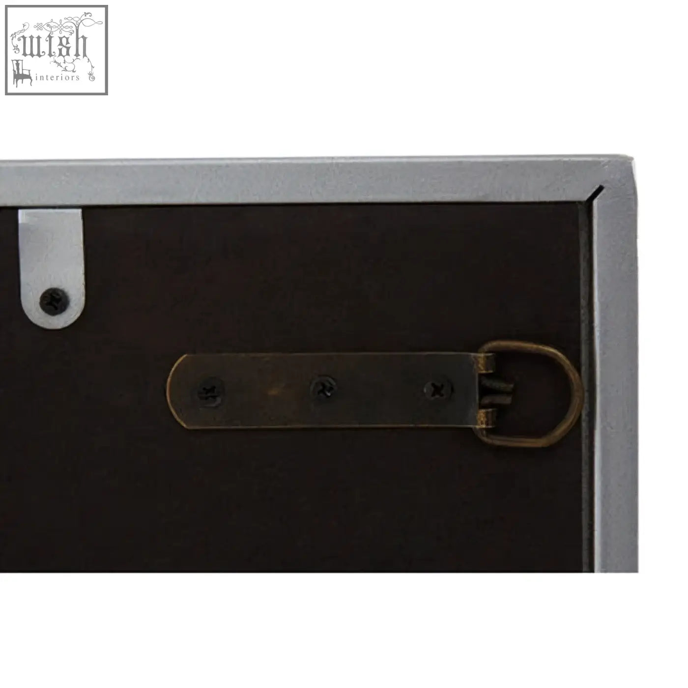 The back of a dark brown wooden frame with a silver bracket and antique brass buckle for the large solar effect wall mirror