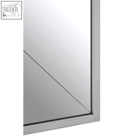 Silver-framed large solar effect wall mirror with a sleek minimalist design perfect for modern decor