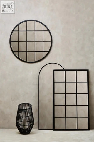 Black metal framed descartes round metal wall mirror with circular and rectangular grid design