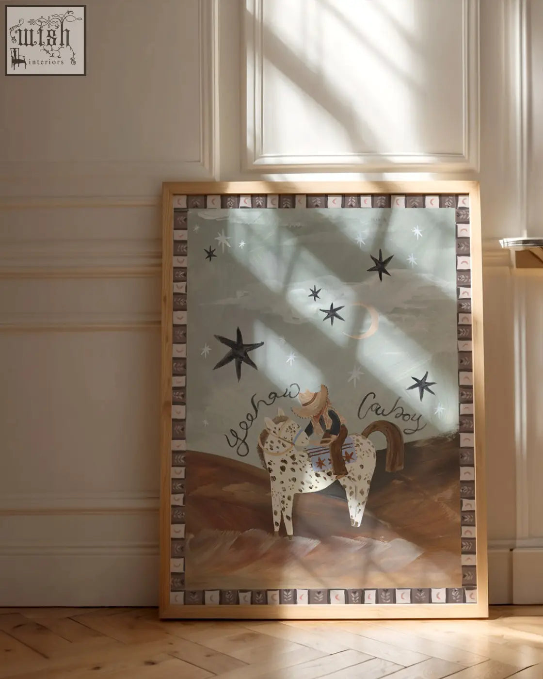 A framed art print of a whimsical desert cowboy on a spotted horse under a moonlit desert starry sky