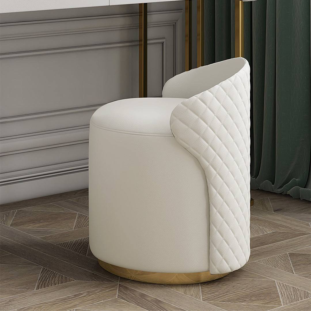 Cream-colored upholstered stool with quilted panel and gold-tone base for devorit dressing table white setup