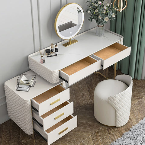 White quilted devorit dressing table with gold-tone drawer pulls and matching round mirror on stand