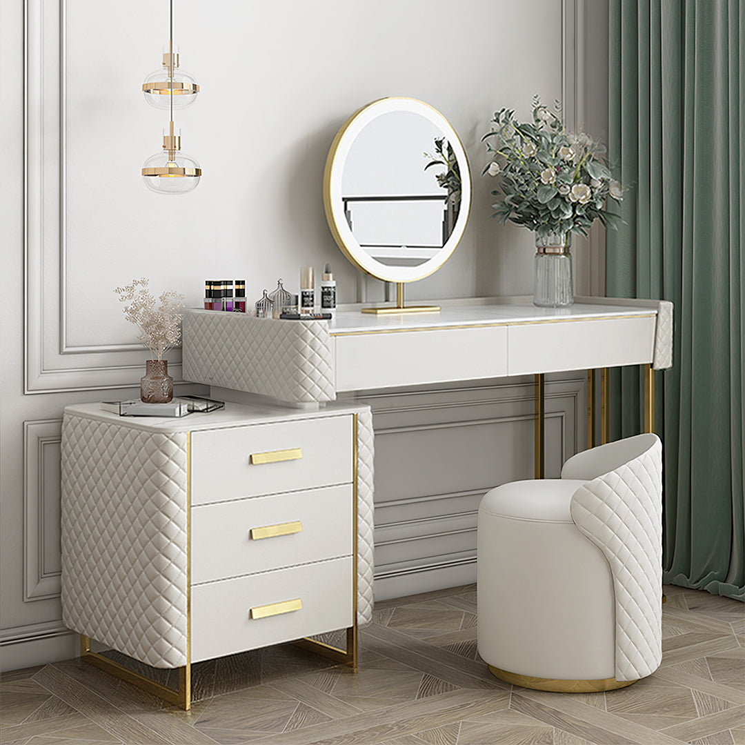 White quilted devorit dressing table with gold-tone legs drawer handles and matching round mirror on top