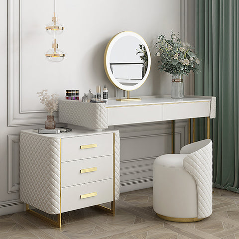 White quilted devorit dressing table with gold-tone legs drawer handles and matching round mirror on top