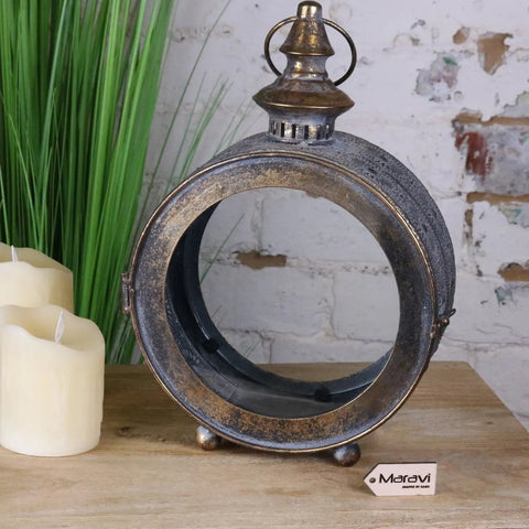 Antique-style metal devra vintage style round lantern with distressed silver and brass finish and ornate detailing