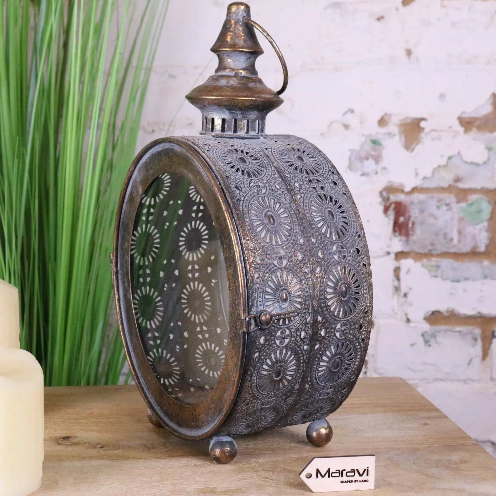 Antique-style devra vintage style round lantern with intricate bronze metal cutouts and three small feet