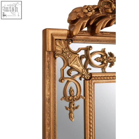 Deymonte ornate mirror with gold finish featuring an ornate frame and intricate baroque-style corner carvings