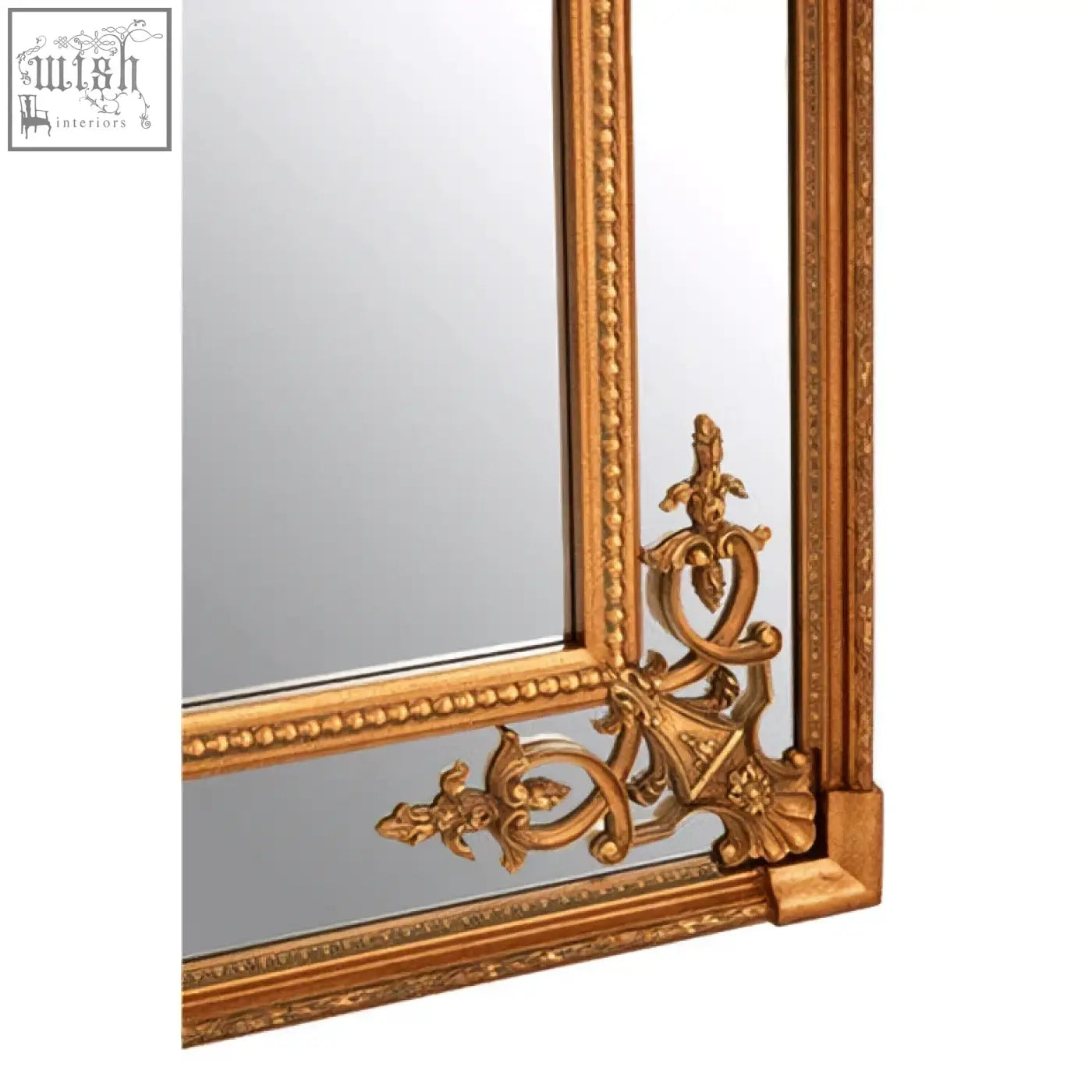 Gold finish deymonte ornate mirror with intricate scrollwork and beaded detailing on a golden ornate mirror frame
