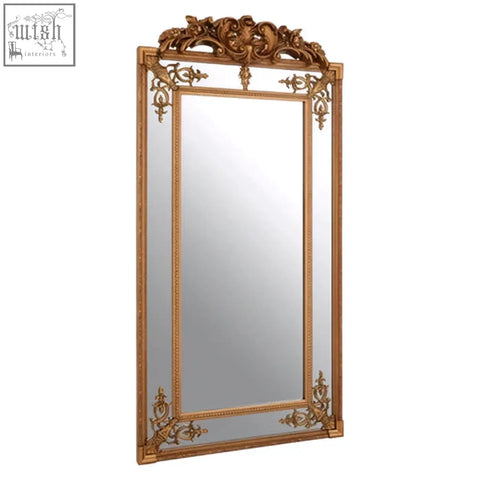 Deymonte ornate mirror with gold finish featuring intricate baroque-style carvings and a decorative crest on top