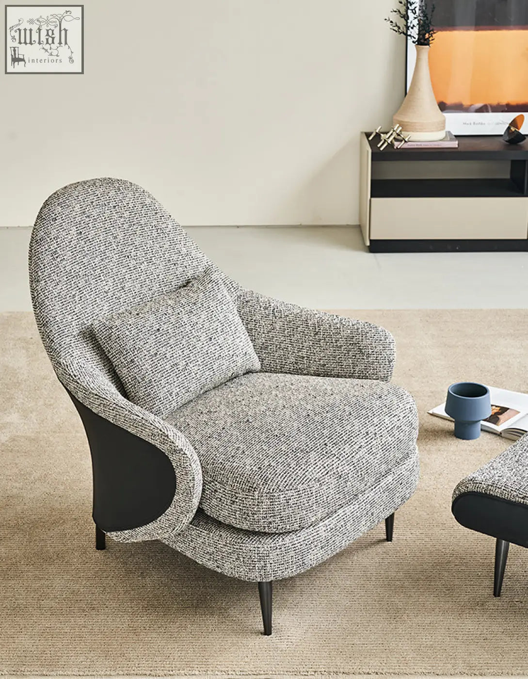 Modern gray textured diakite armchair with sleek black linen and leather panels perfect for your living space offer financing
