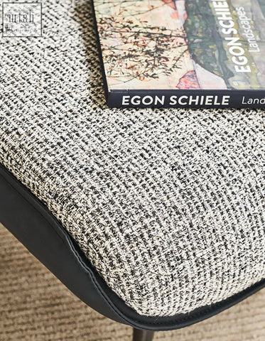Textured gray and white tweed cushion with black leather trim for diakite armchair to upgrade your living space