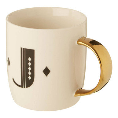 Cream-colored ceramic diamond deco white mug with gold-toned handle and black monogram j with diamond accents