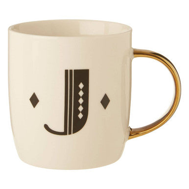 Cream-colored ceramic mug with gold-toned handle and black monogram j in diamond deco white style