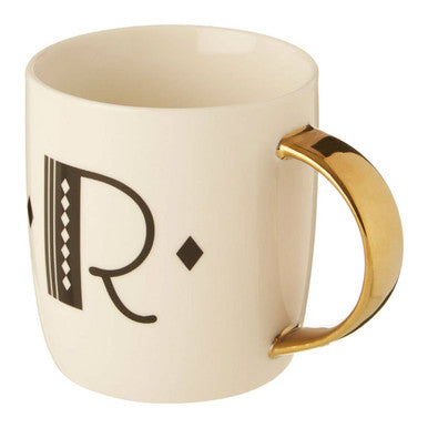 Cream-colored ceramic diamond deco white mug with gold handle and black ornate r lettering design