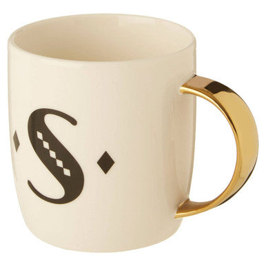 Cream-colored ceramic diamond deco white mug with gold handle and black monogram s design with diamond accents