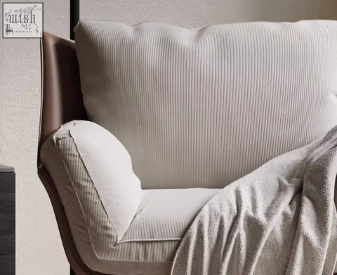 Cream colored dias armchair with ribbed corduroy upholstery and sleek brown leather frame great for shipping cost savings
