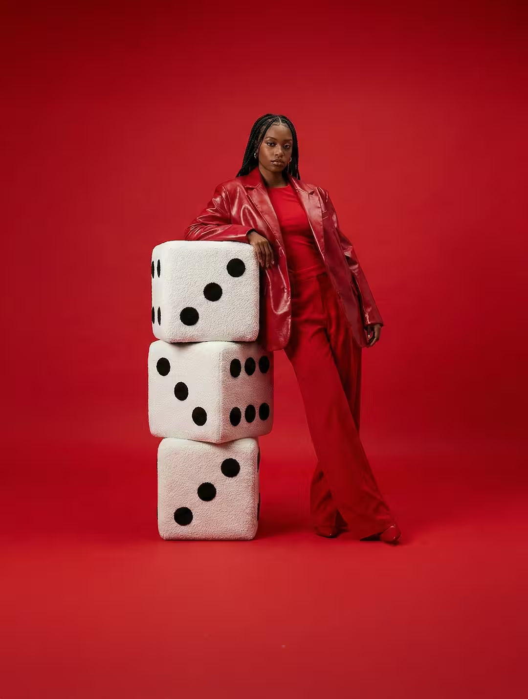 Stack of three oversized white dice footstools 22cm x 22cm upholstered in plush textured fabric dice footstools