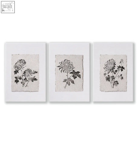 Set of three framed dining room wall art prints featuring monochrome chrysanthemum ink study on textured paper