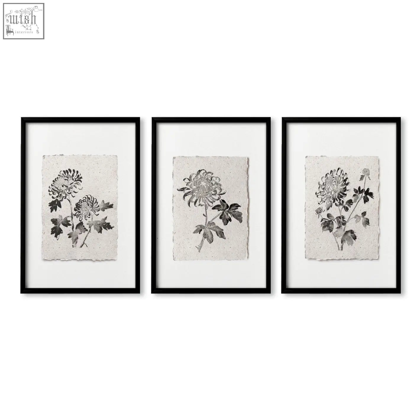 Set of three black-framed botanical chrysanthemum wall art prints on textured paper perfect for dining room decor