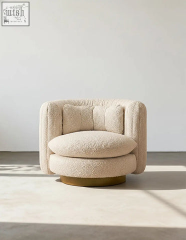 Cream-colored dino armchair with plush boucle fabric and swivel base offering stylish armchair features and financing options