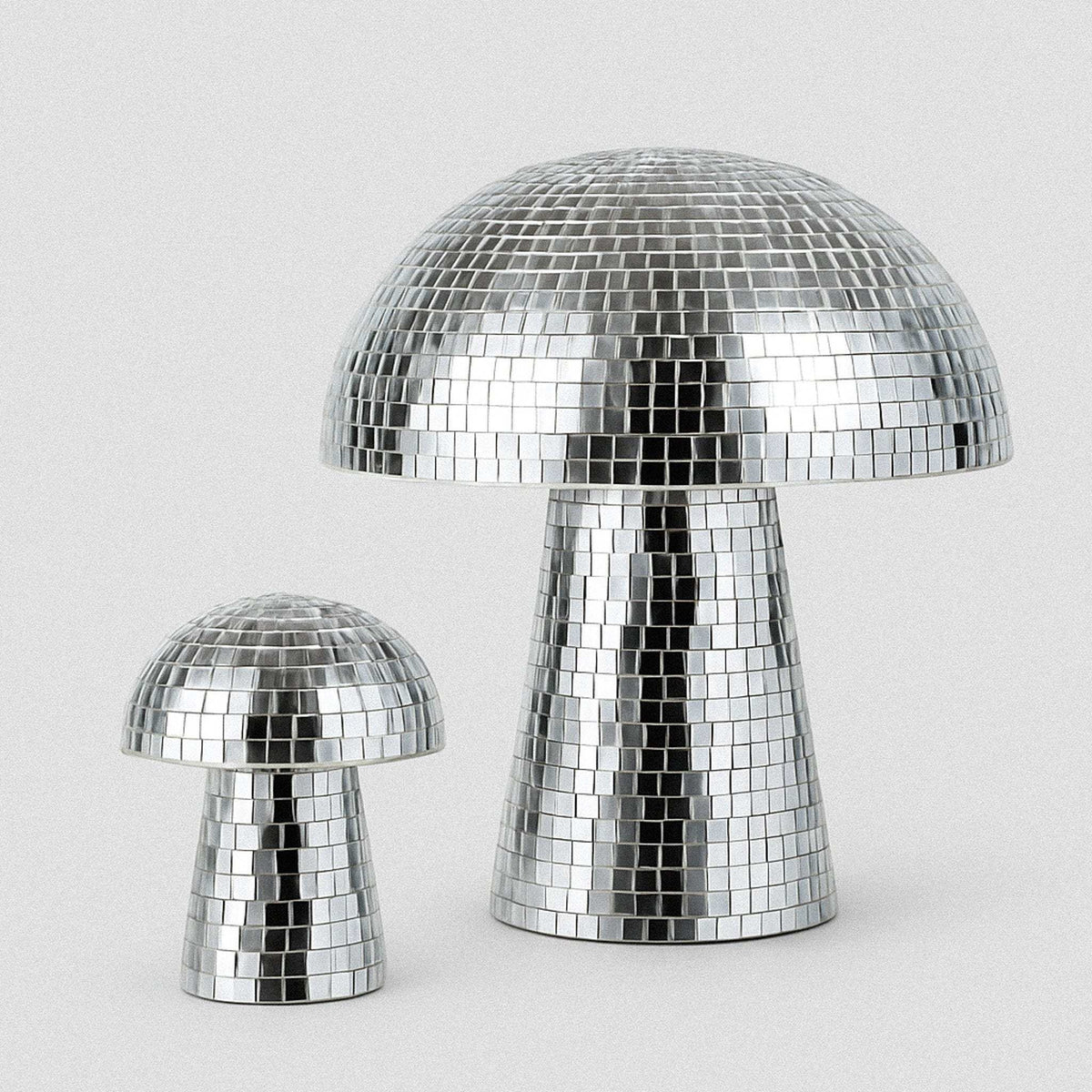 Shiny silver disco mushrooms decor with mirrored mosaic tile surface to infuse joy and retro vibes