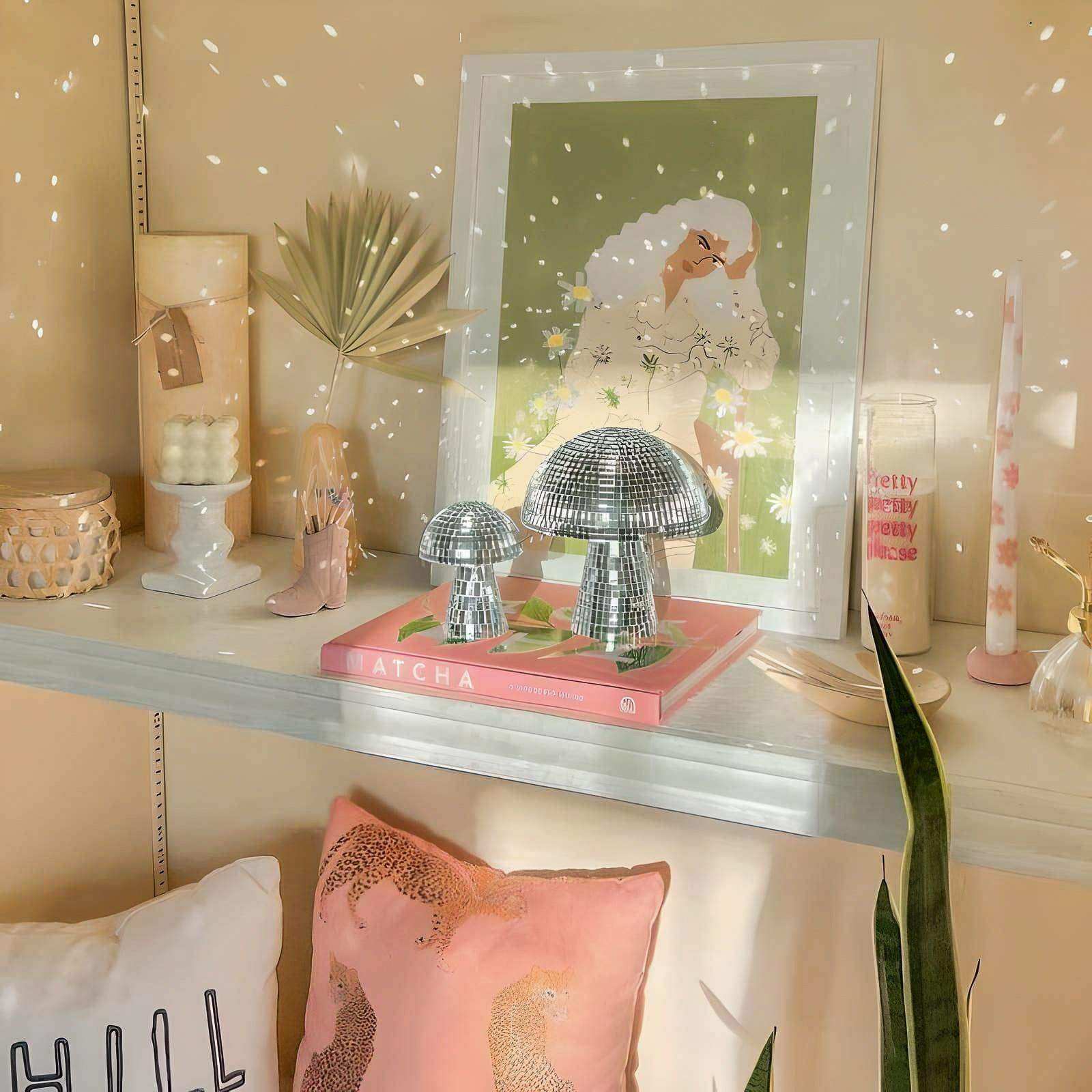 Shiny silver disco mushrooms made of reflective material to infuse joy with funky mushroom decor