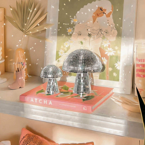 Shiny silver disco mushrooms figurines with mirrored mosaic surfaces to infuse joy and sparkle any space