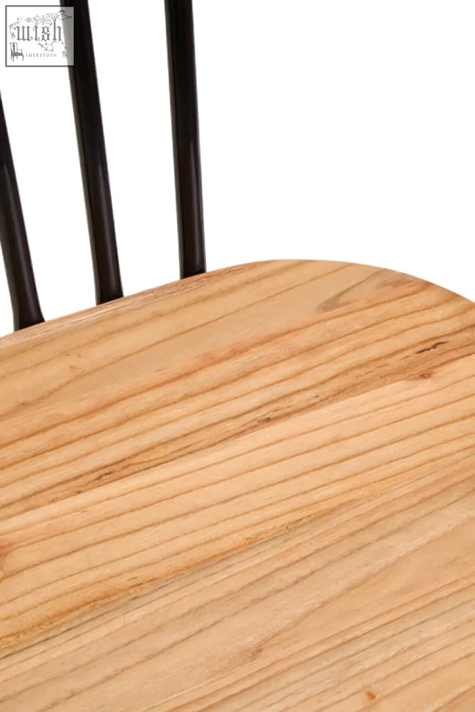 Light-colored elm wood seat dining chair with black vertical spindles and metal frame for stylish dining rooms